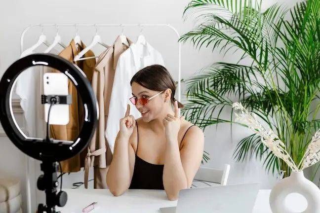 Female influencer showcasing a product for social media